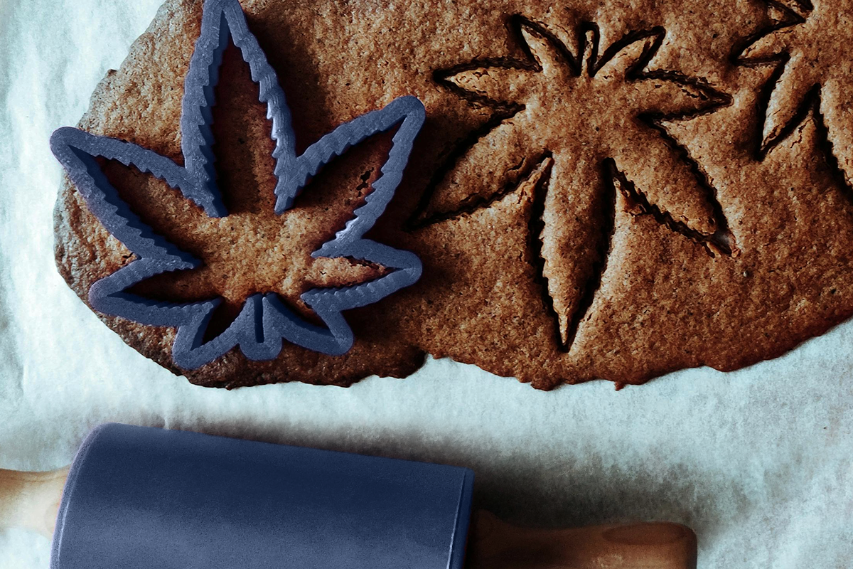 Weed shaped cookie cutter, cutting out some gingerbread cookies.