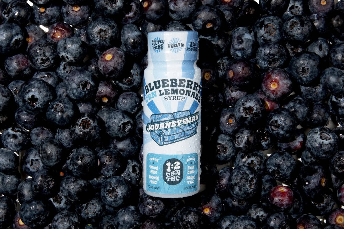 A blueberry THC drink in a blue bottle.