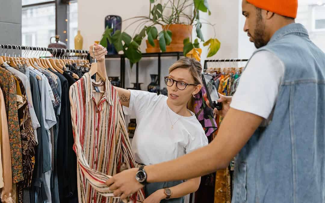 Woman and man shopping at a vintage clothing store.